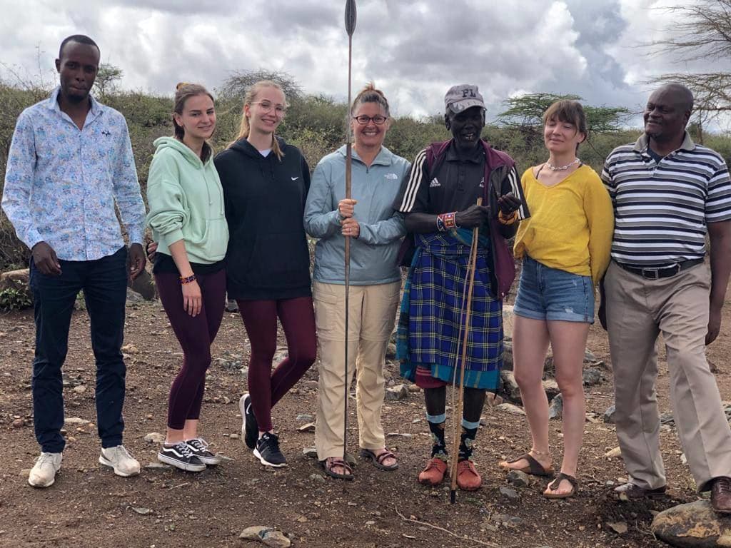 CEO with volunteers in forest