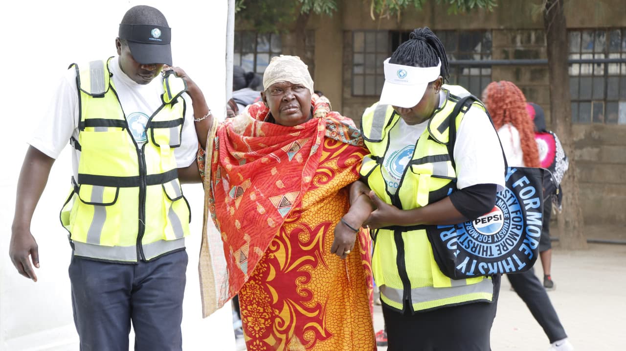 Patient receiving assistance at Samburu medical camp