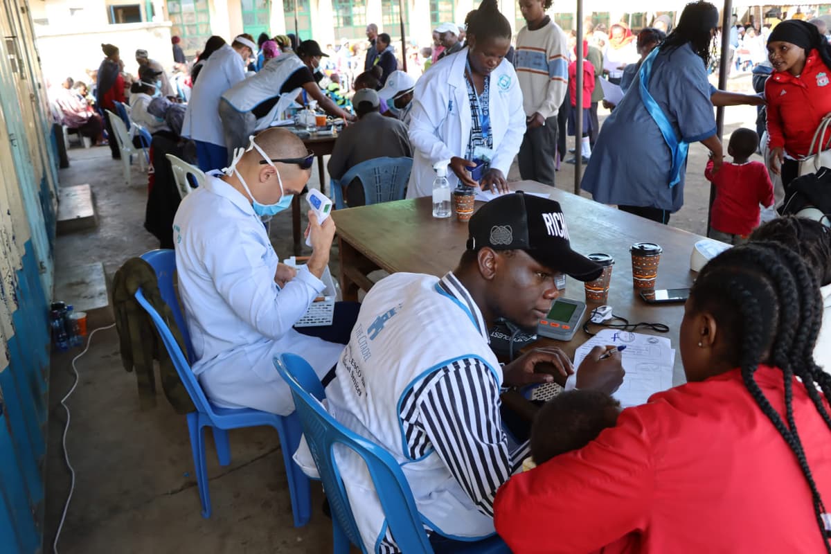 Medics setting up desks for patients